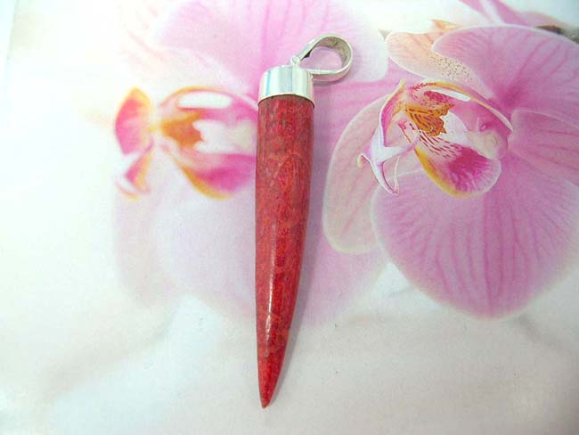 Anniversary gift jeweler online distributes Ruby red gemstone pendant in elephant tusk design with 925. sterling silver mounting