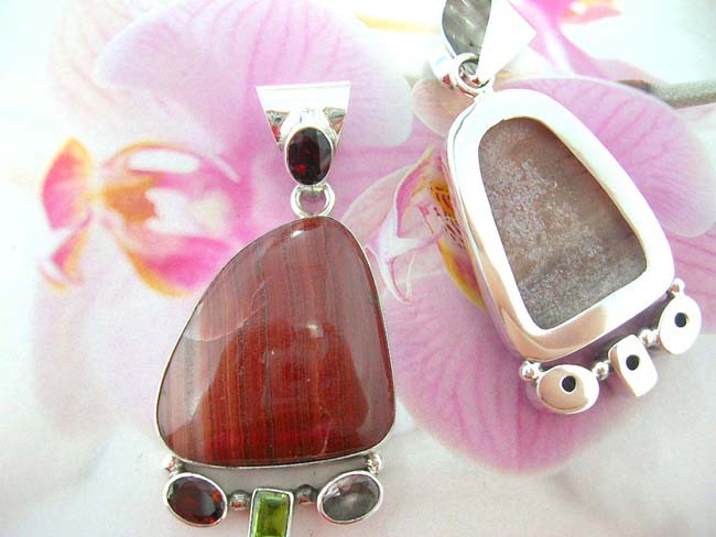 Designer jewelry distributor imports gemstone pendant with crystals at bottom on 925. sterling silver frame