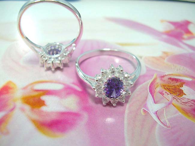 Contemporary bali wear accessory shop, Amethyst gemstone in center of imitation diamonds forming petals to beautiful flower inspired ring