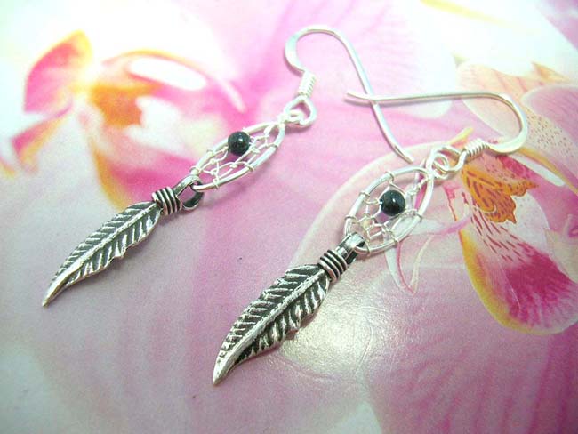 Oval dream catcher with black bead earrings holding two feathers. Native crafted from 925. sterling silver , Indonesia accessory shopping exchange 