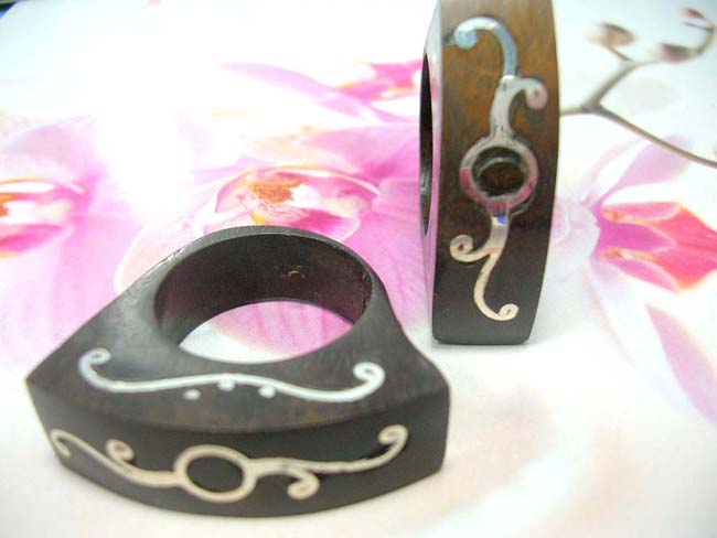 Afforble extoic wear jewelry. 925. Sterling silver tribal art desiign on bali made wooden ring 