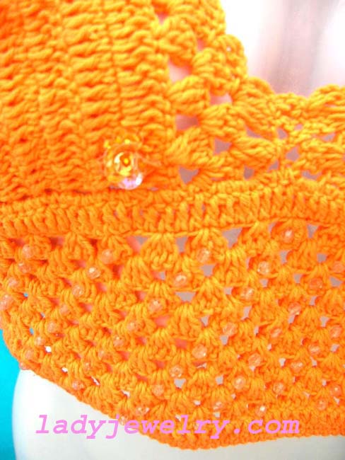 Indonesia fashion clubwear boutique. Beach halter top in bright orange knitted design 