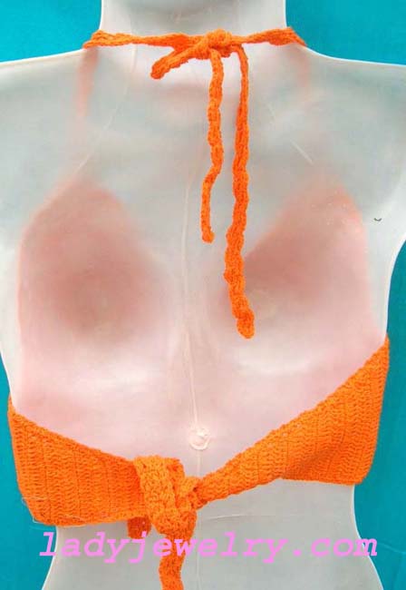 Indonesia fashion clubwear boutique. Beach halter top in bright orange knitted design 
