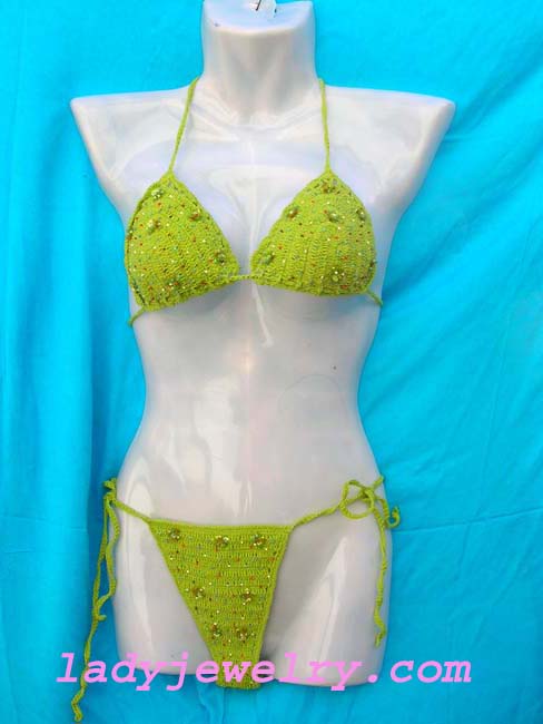 Exotic green balinese crochet knit beach bikini with trendy beads and flowers made from sequin . Beauty beach supply store 