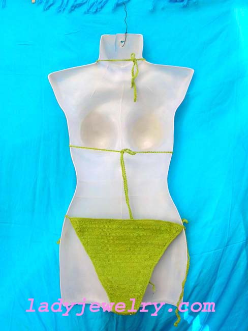 Exotic green balinese crochet knit beach bikini with trendy beads and flowers made from sequin . Beauty beach supply store 