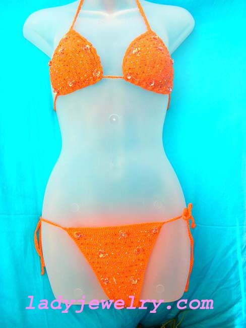 Holiday travel wear clothing outlet. Sexy orange batik beach bikini with crafted beads and sequin flower design 