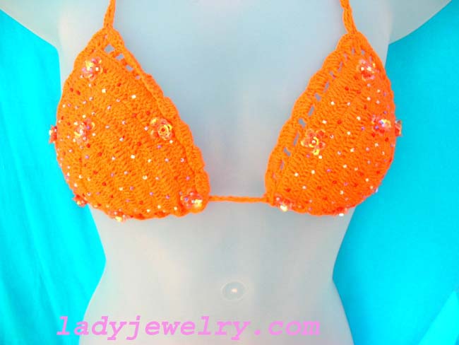 Holiday travel wear clothing outlet. Sexy orange batik beach bikini with crafted beads and sequin flower design 