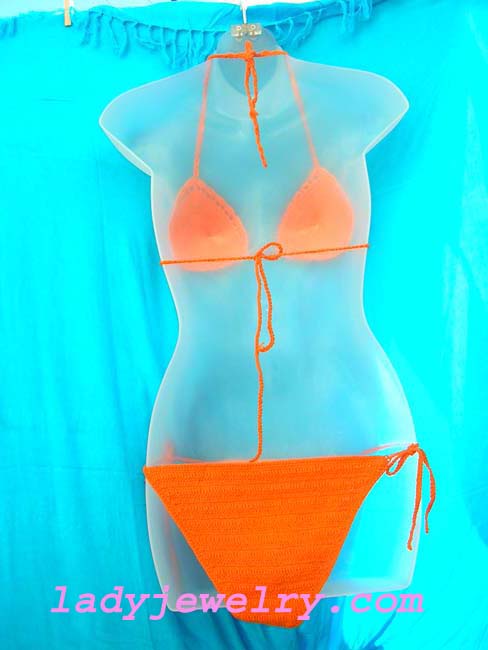 Holiday travel wear clothing outlet. Sexy orange batik beach bikini with crafted beads and sequin flower design 