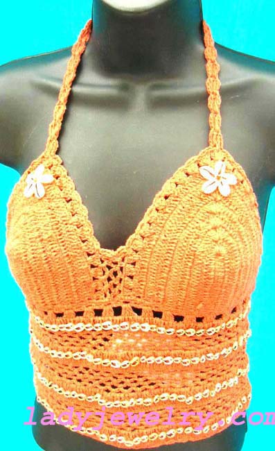 Designer wholesale summer fashion. Indonesian summer needle art halter top in orange with seashell beaded lines on bodice and shell flower crests   