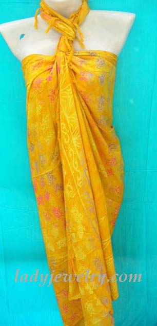 High style leisure apparel store. Rayon bali sarong wrap in yellow with multi colored turtle motif design 