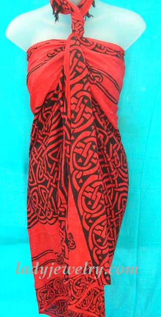 Intricate Celtic knot art pattern on exotic red and black pareo wrap. Ladies urban beach beauty supplies 