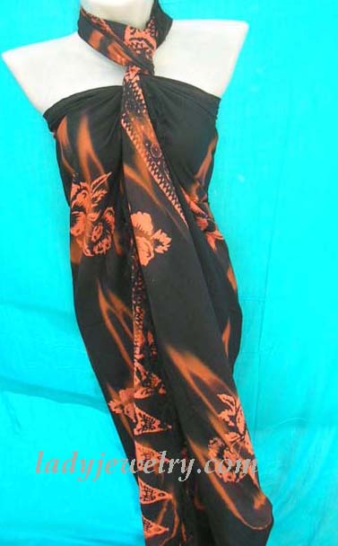 Glamour beach wear gift store. Hawaiian flower print design in orange on ladies beach batik scarf 