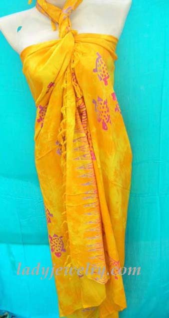 Jewelry art and apparel outlet shop. Purple and red ocean turtle pattern on summer yellow batik wrap 