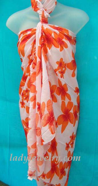 Exclusive fashion supply outlet. Caribbean style sarong with orange flower print on white background 