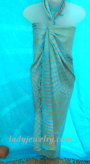 High style summer apparel fashion retailer. Silver spiral adorned, aqua blue beach sarong 