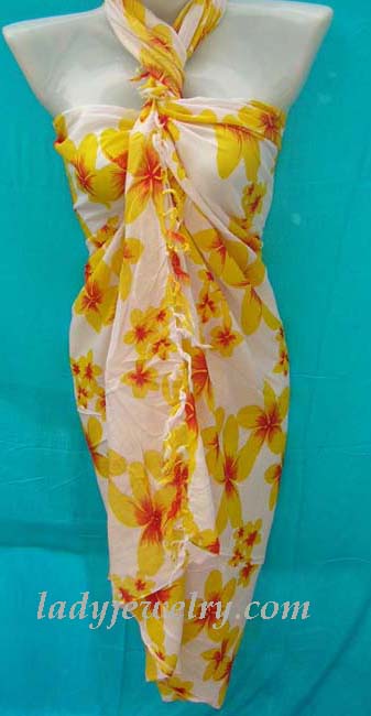 Garden wear yellow and orange floral print on white batik sarong wrap. Island fashion sarongs supply shop 