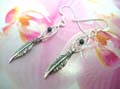 Oval dream catcher with black bead earrings holding two feathers. Native crafted from 925. sterling silver , Indonesia accessory shopping exchange 
