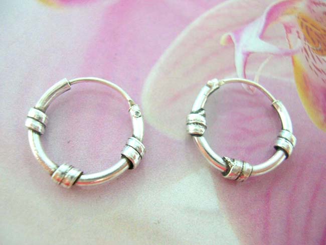 Contemporary art jewelry wholesaler supplies Bali wear hoop earrings with three wrap around bands, made from 925. sterling silver