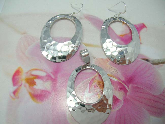 Modern sterling silver earring and pendant set in cut out oval design from indonesian export company