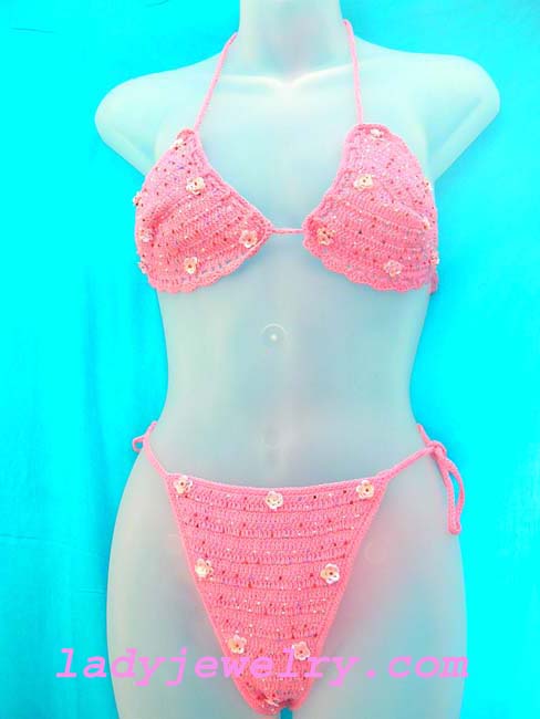 Fun light pink crochet bikini with floral pattern in sparkling sequin. Summer leisure wear gift shopping boutique. 